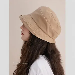 Japanese style washed cotton breathable bucket hat with roll-up brim for women in beige