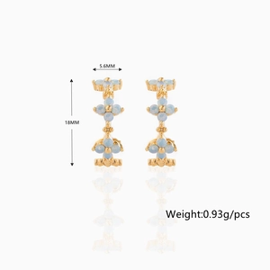 Detail view of 18K gold plated flower earrings with blue zircon and size dimensions