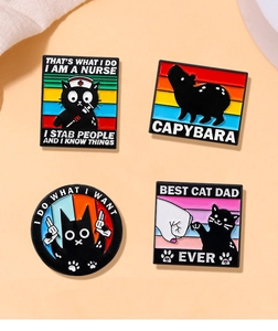 Set of four unique enamel pins featuring cartoon cats and capybara with funny English text