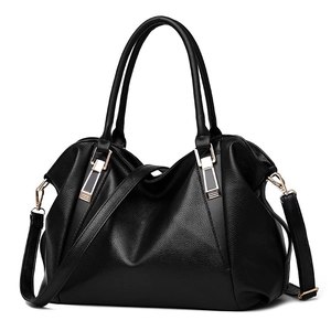 Black textured PU leather handbag with gold hardware and shoulder strap on white background