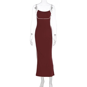 Detail of burgundy bodycon maxi dress with white piping and spaghetti straps