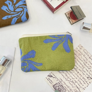 Floral print canvas storage pouch with green floral patterns for cosmetics and small items