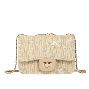 Straw square shoulder bag with floral embroidery and gold chain strap in beige