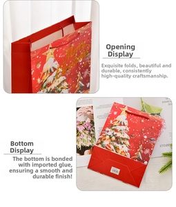 Close-up of red Christmas gift bag showing durable handles and reinforced bottom detail