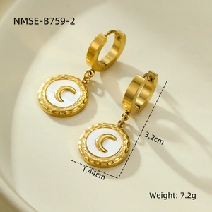 Detail of 18K gold stainless steel earrings with shell moon inlay and hammered texture