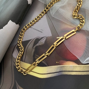 Detail of chunky gold titanium Cuban link necklace with rectangular hollow chain segments