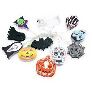 Detail of Halloween LED string lights with ghost, pumpkin, and bat shapes on white background