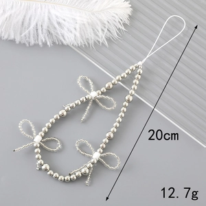 Dragonne de téléphone en perles argentées avec nœuds blancs, longueur 20cm, style raffiné