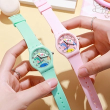 Close-up of silicone sports watches for kids in mint green and pink with dinosaur dials