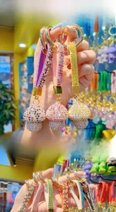 Close-up of sparkling colorful mushroom keychains with rhinestone leather lanyards