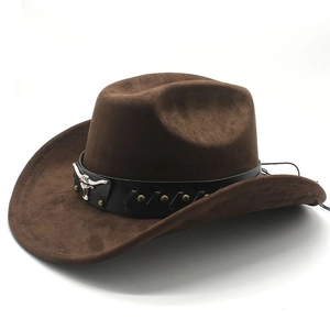 Detail of dark brown faux suede cowboy hat with black leather band and silver bull head buckle