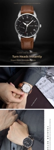 Detail of quartz watch with roman numerals dial, leather strap and luminous hands