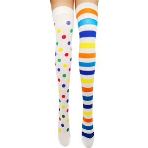 Detail of asymmetric white knee-high socks with colorful polka dots and stripes