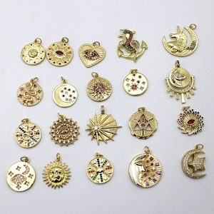 Assorted 18K gold plated charms with micro-pave crystals in sun, moon and heart shapes