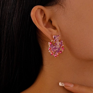 Elegant gold peacock earrings with pink and purple gradient crystals for a vintage look