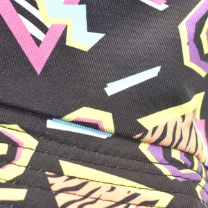 Macro shot of fabric texture with geometric patterns and zebra print on the sun hat