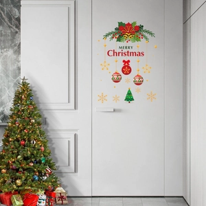 Merry Christmas wall stickers with bells and snowflakes on a white door and decorated tree