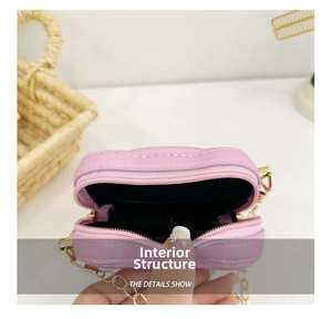 Detail view of the lavender quilted coin purse showing interior lining and metal zipper