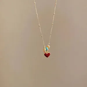18k gold plated necklace featuring a red enamel heart and colorful beaded accents
