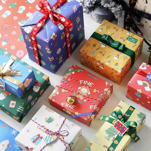 Assorted Christmas gift boxes with festive patterns, ribbons, and decorative bells