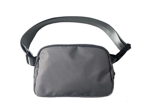 Close-up of grey waterproof nylon waist bag with adjustable strap and plastic buckle