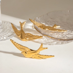 Vintage stainless steel bird swallow jewelry set in gold finish on white background