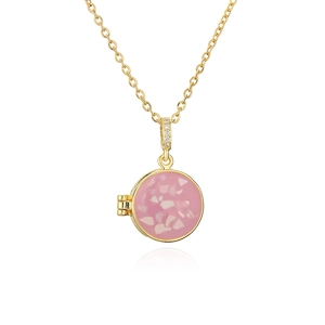 Gold round locket necklace with pink terrazzo stone and micro-pave crystals on white background
