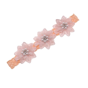 Macro detail of elastic lace headband with three layered chiffon flowers and pearls