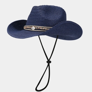 Detail of navy blue straw cowboy hat with ethnic style band and adjustable wind rope