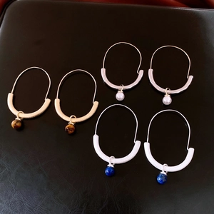 Detailed set of three U-shaped hoop earrings with tiger eye, pearl and lapis stone beads