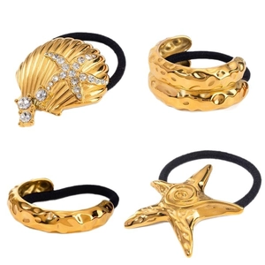 Golden starfish and seashell hair ties with sparkling rhinestones and matching metal bracelets
