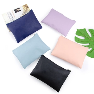 Minimalist PU leather pouches in five colors with silver zippers on white background