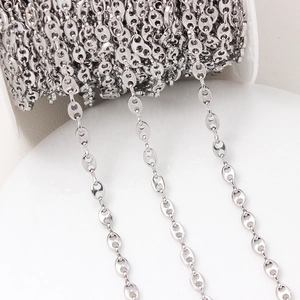 Macro shot of silver coffee bean link chain rolls for DIY jewelry making and accessories