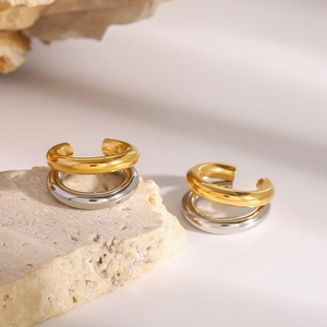 Dual-layer C-shaped non-piercing ear clips in gold and silver finish on stone