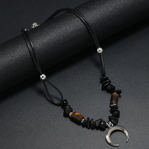 Bohemian beaded coconut shell necklace with silver crescent pendant and stone beads