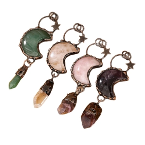 Vintage moon and star crystal pendants with antique bronze wire wrapping on white background