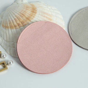 Detailed view of pink microfiber jewelry pouch with fine stitching and soft suede texture