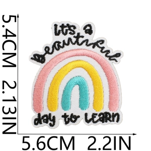 Close-up of rainbow embroidery patch with It's a beautiful day to learn quote and dimensions