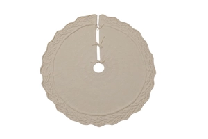 Detail of beige cable-knit Christmas tree skirt with decorative bow tie closures