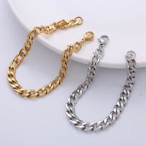 Minimalist 7mm stainless steel chain bracelets in gold and silver finish on a white plate