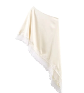 Detailed view of cream satin hem with delicate lace trim on an asymmetric casual top