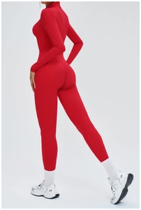 Side view of red high-elasticity fitness jumpsuit showing body-shaping fit and fabric