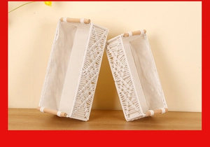 Detail view of woven cotton rope storage baskets featuring minimalist wooden handles