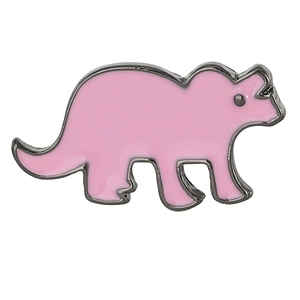 Close-up of pink triceratops enamel brooch with polished silver-black metal edging