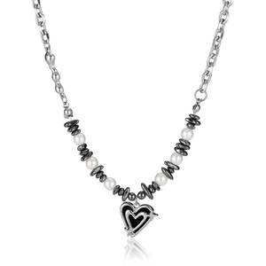 Titanium steel heart necklace with pearls and black pendant over white background