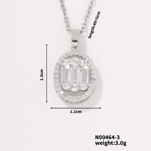 Macro detail of oval pendant necklace with dimensions 1.3cm x 1.1cm and silver finish