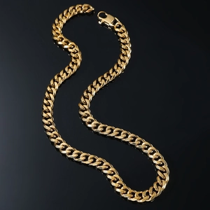 Minimalist gold titanium steel curb chain necklace with polished finish on black background