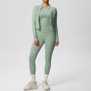 Detail of sage green three-piece yoga set with zip jacket, vest and high waist leggings