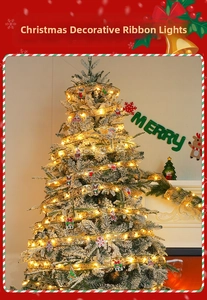 Close-up of LED glowing gold ribbon lights on a snow-covered Christmas tree decoration