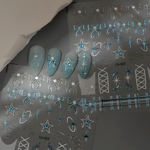 Detail of Co-523 blue bow and star nail art stickers with embossed 3D pearl texture
